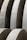 Massive concrete arches with smooth surfaces, arranged in a repetitive pattern, create a sense of industrial architecture. The structures display meticulous craftsmanship and structural integrity with clean lines and subtle texture variations.