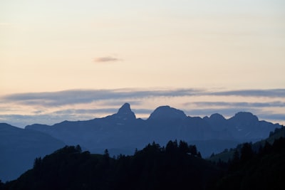 mountains during day mountain range teams background