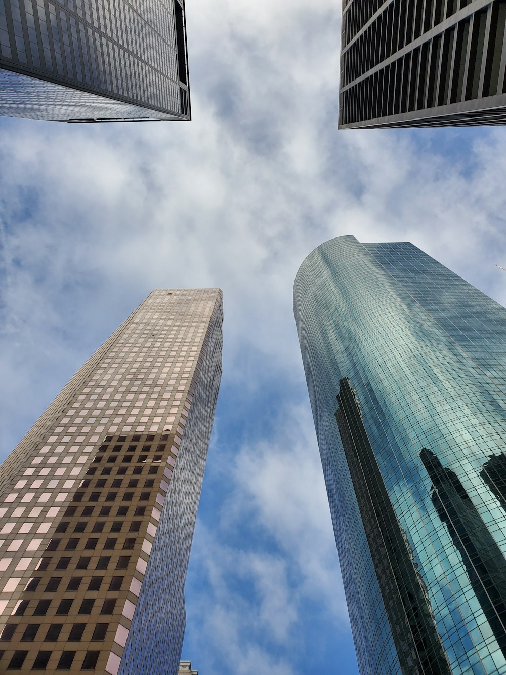 low photography of four high-rise buildings