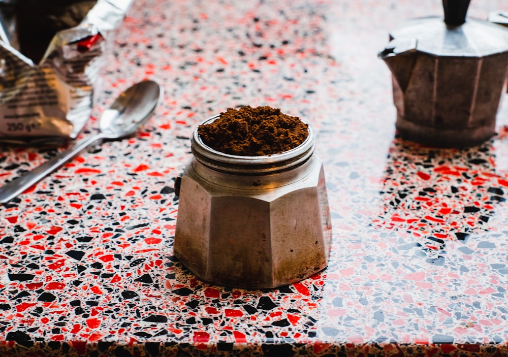 silver moka pot on table