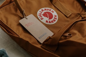 shallow focus photo of brown Kanken bag