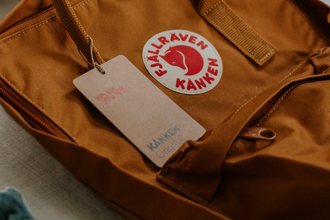 shallow focus photo of brown Kanken bag, #kankenoriginal #kankenbackpack #fjallravenkanken
