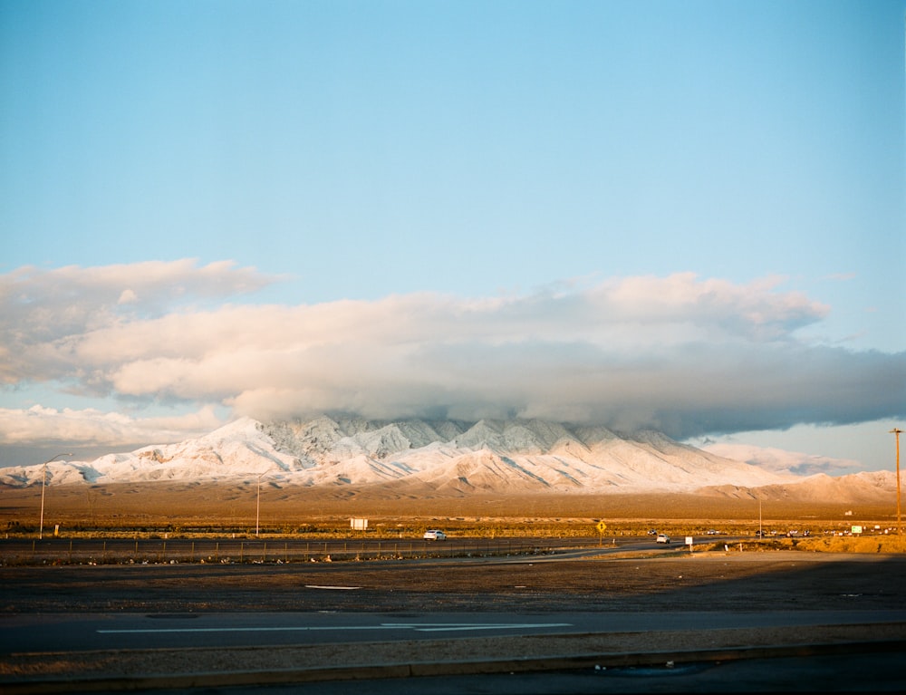 glacier mountains and grass field during day