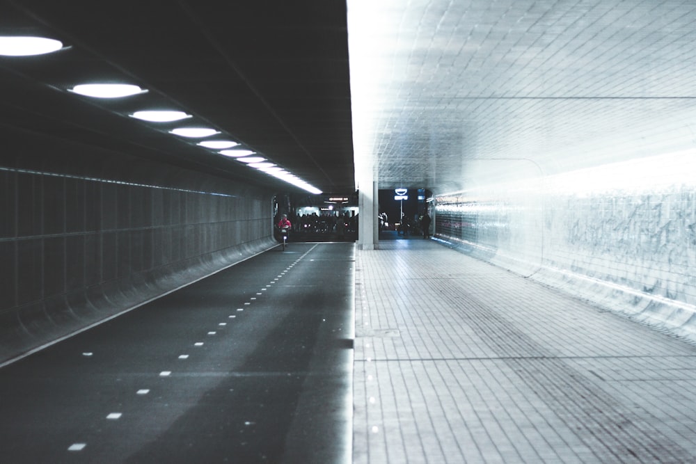 a car driving through a tunnel in the dark