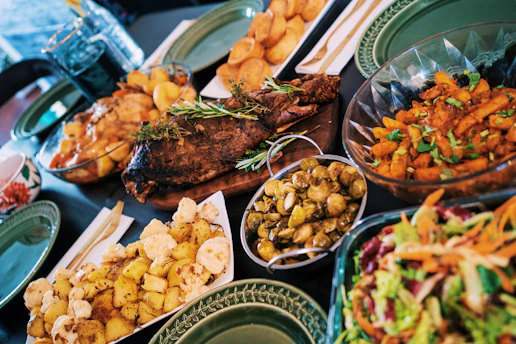 A lavish spread of traditional dishes presented elegantly on a banquet table.