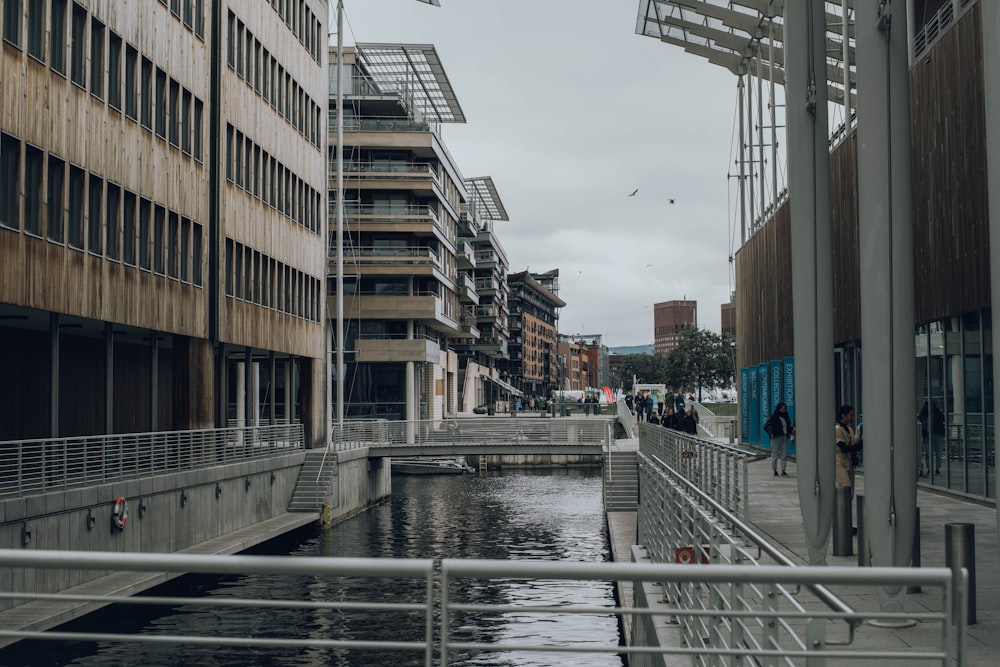 a river running through a city next to tall buildings