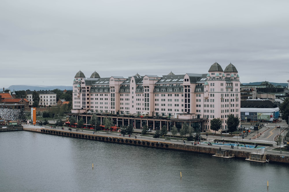 high-rise building and calm body of water