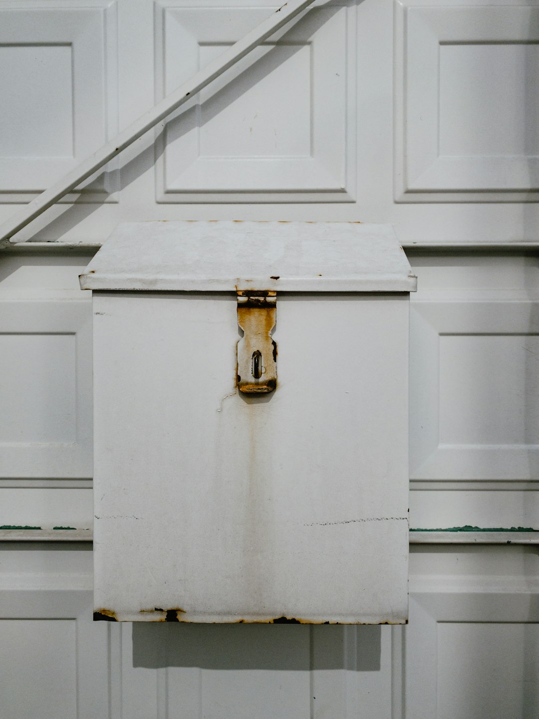 white wall-mount metal storage box