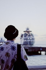 man on dock near cruise