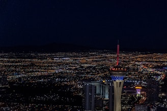 aerial photography of city with high-rise buildings during night time