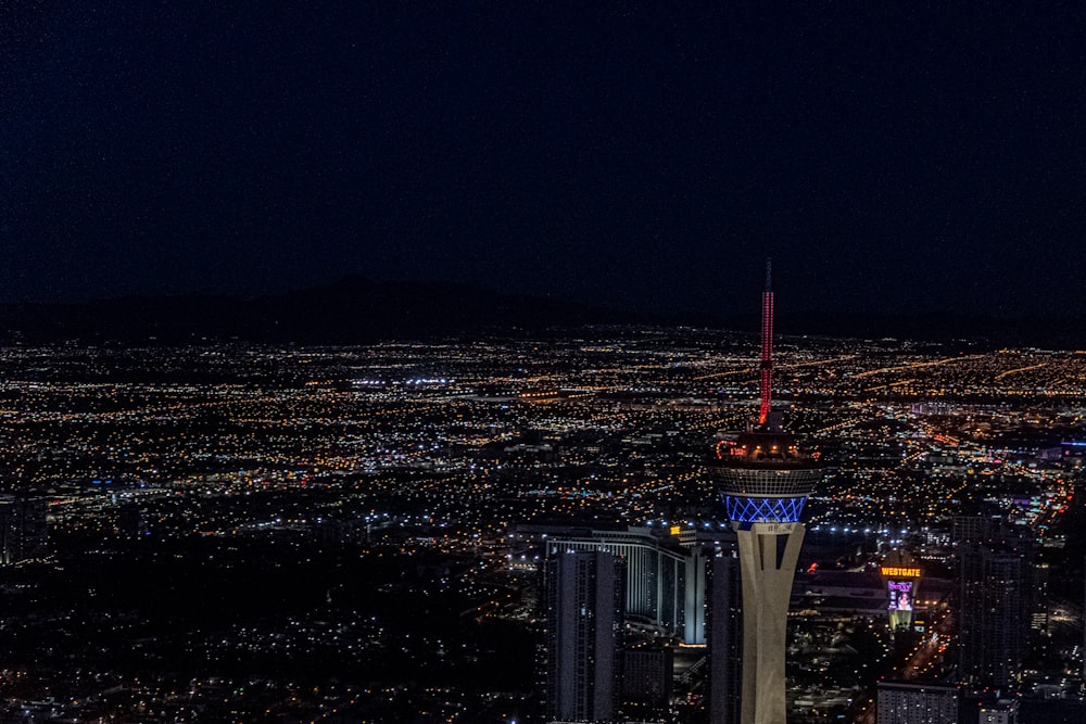 aerial photography of city with high-rise buildings during night time