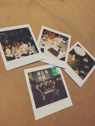 A happy family holding their printed Polaroid photos.