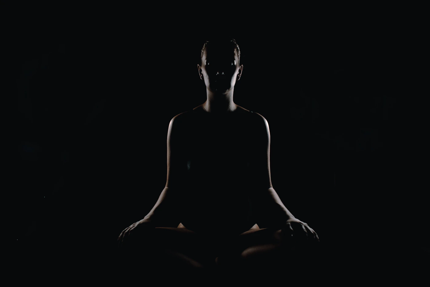 Person meditating in a yoga pose