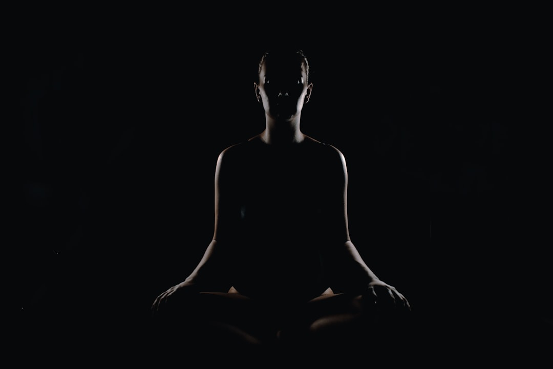 person doing meditation pose,