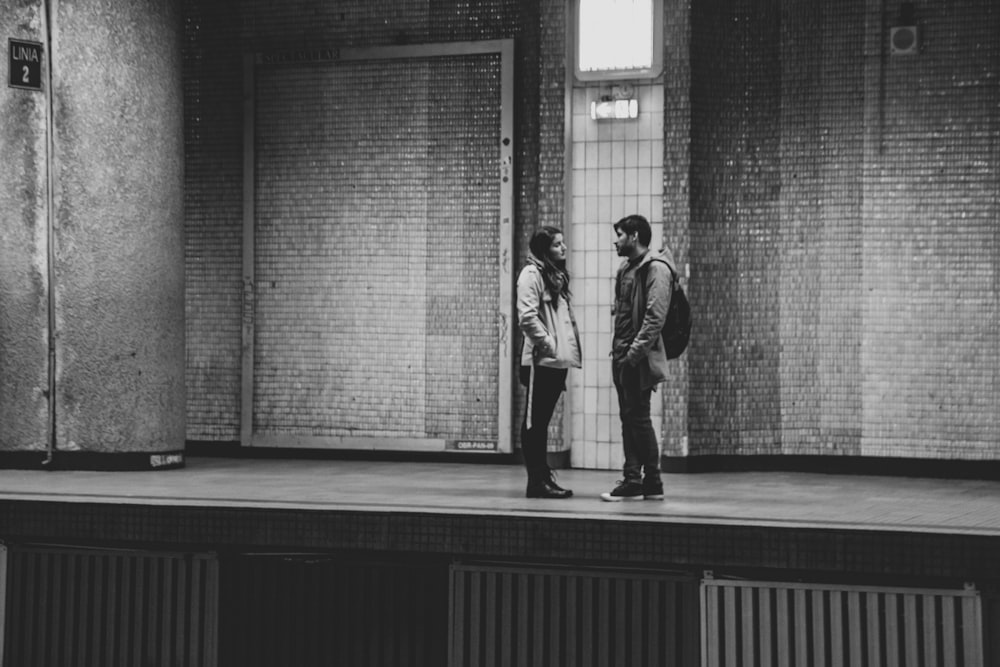 man and woman on train station