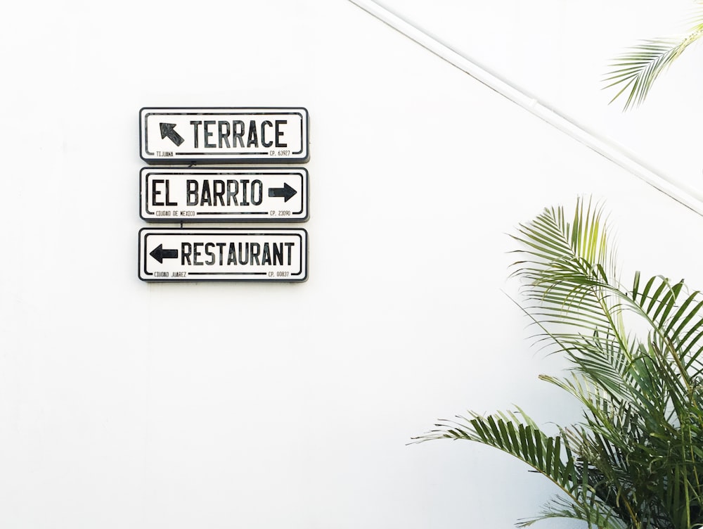 terrace, El Barrio and restaurant signs