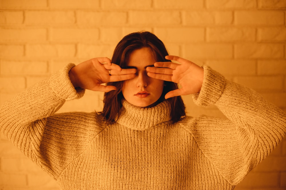 woman in white turtleneck knitted jacket