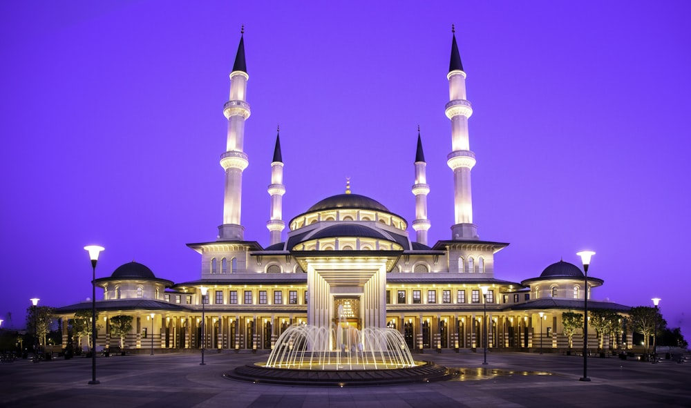 gold mosque during night time