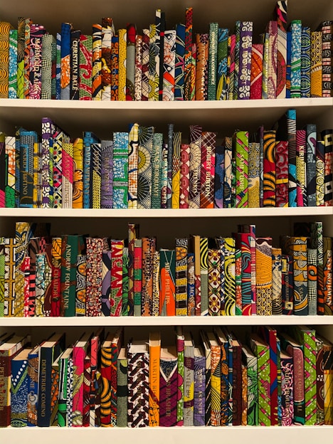 A vibrant display of various coloring books featuring intricate designs.