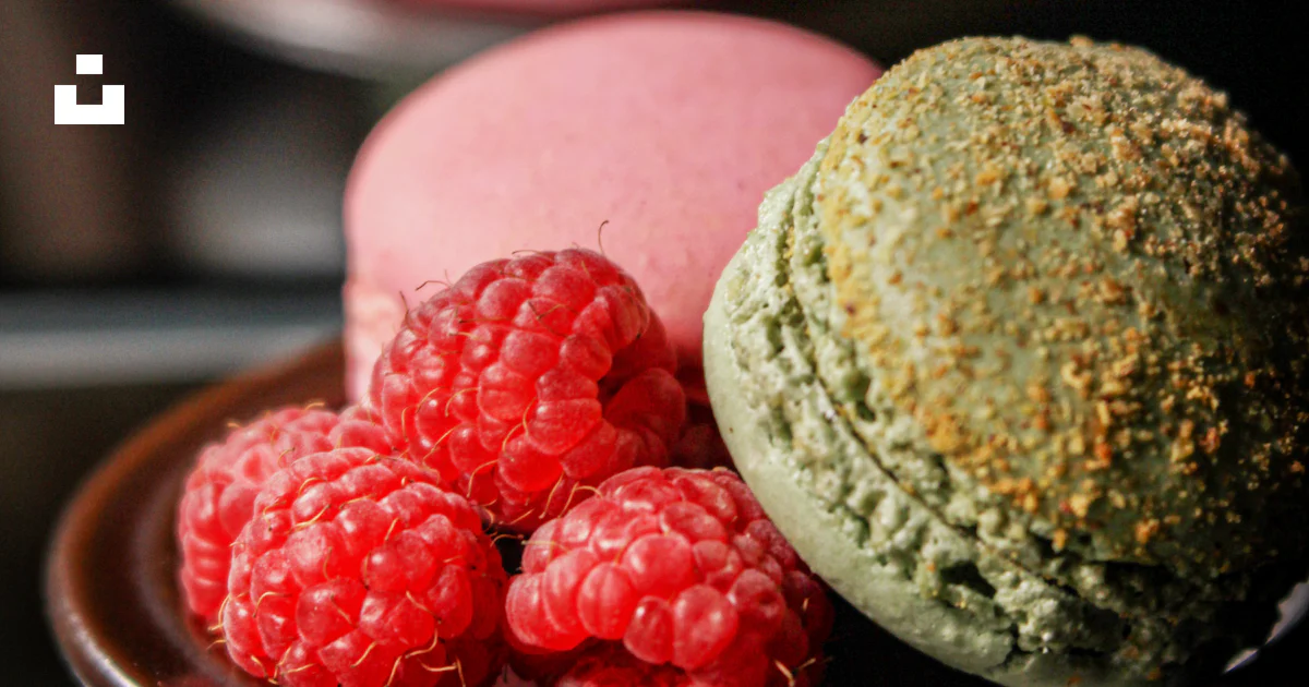 Raspberries and French macaroons on plates photo – Free Food Image on ...