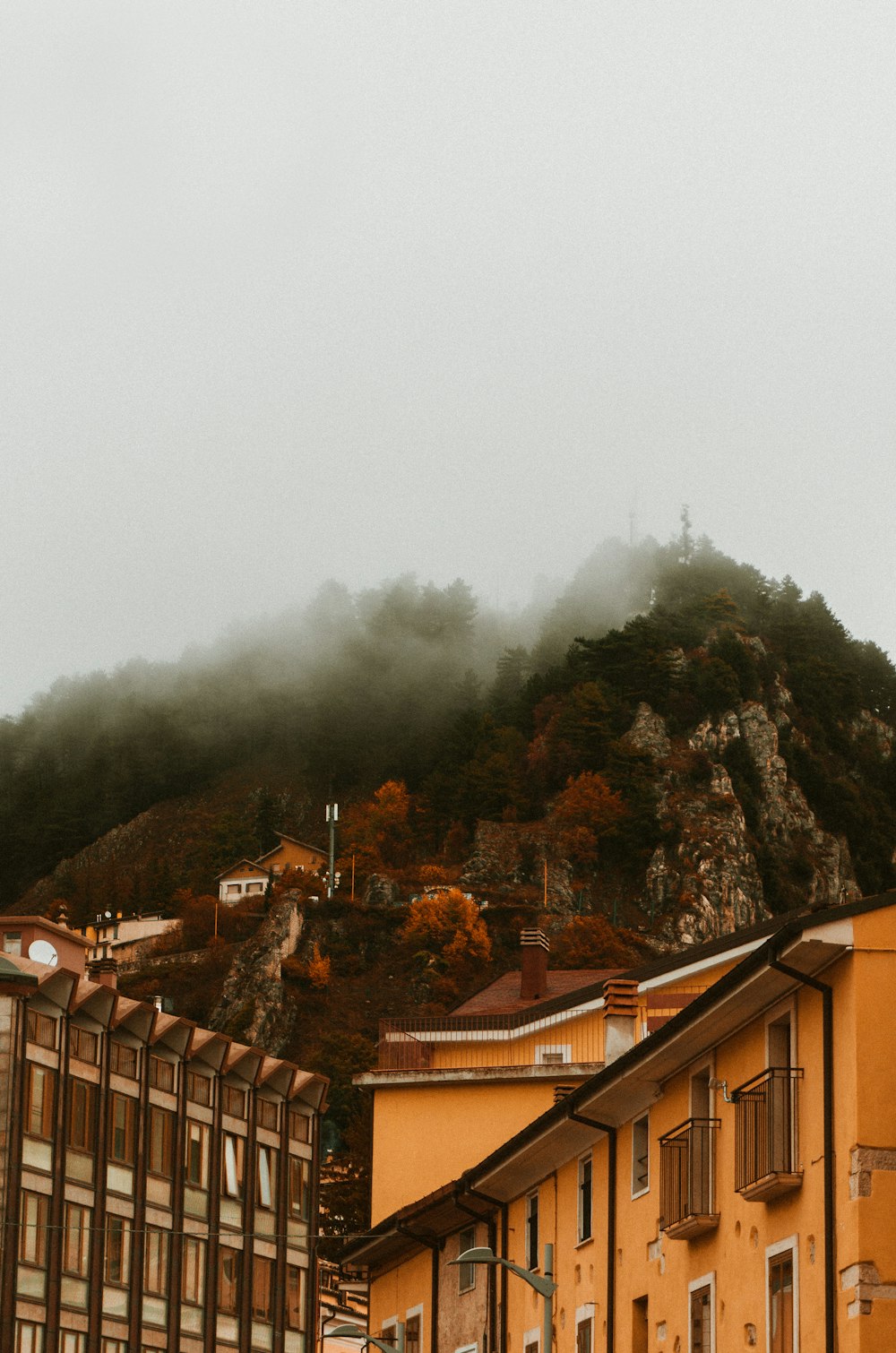 buildings and mountain during day