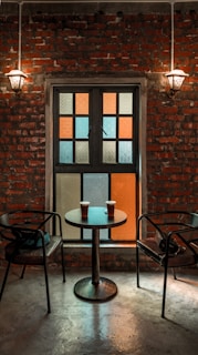 A warm, inviting setting with soft lighting where the Texas Gentleman Cowboy shares a quiet moment over coffee with a businesswoman.