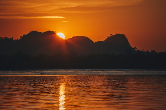 reflection of sun on body of water during golden hour in Teknaf Bangladesh