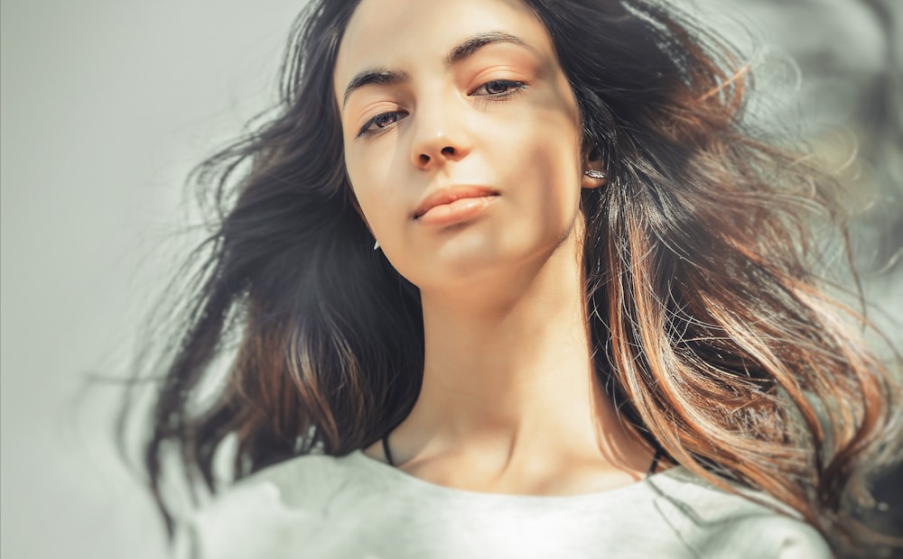 woman wearing gray crew-neck top