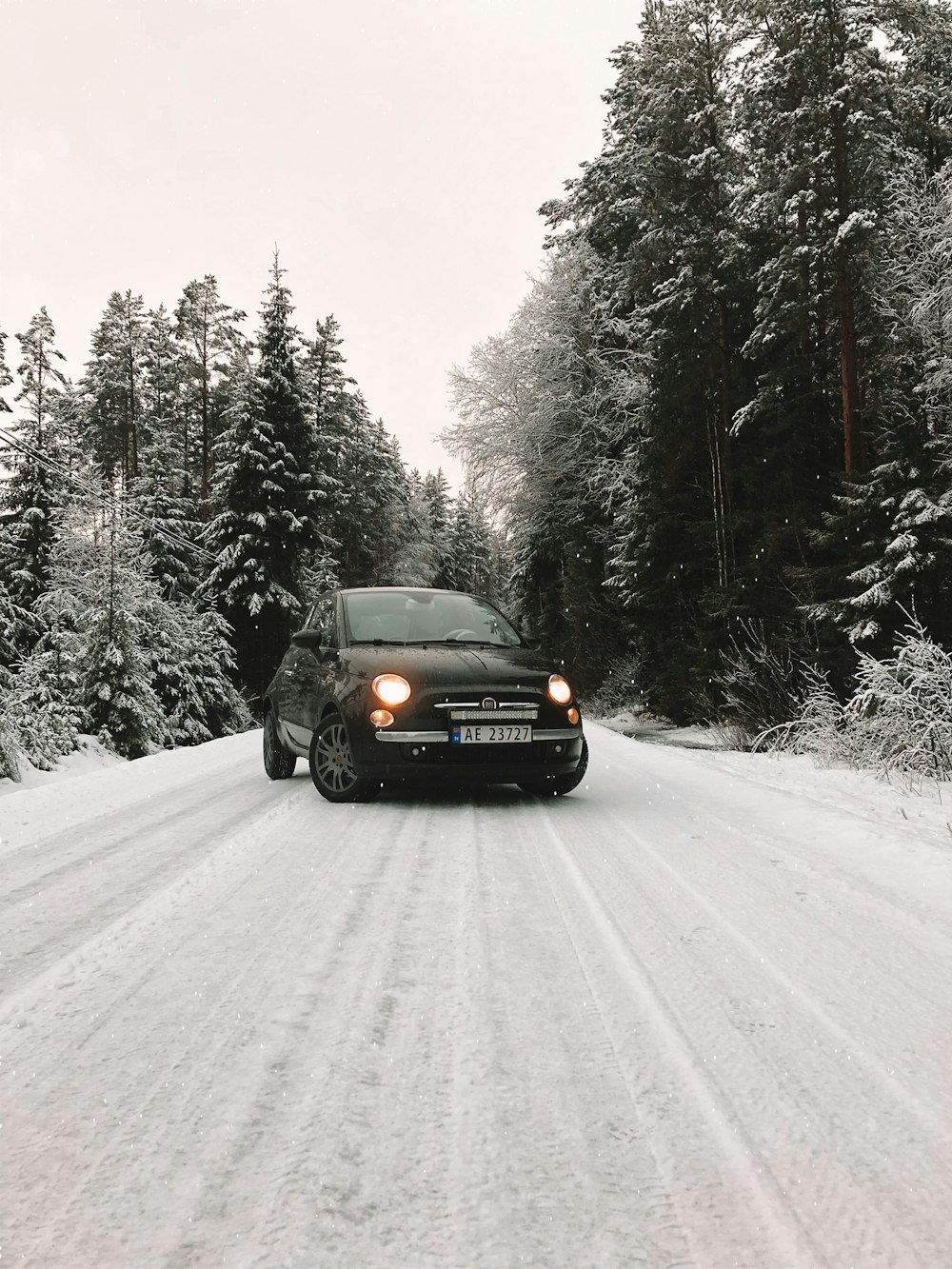 car on snow covered road