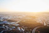 Aerial shot of Bogor cityscape during golden hour with soft sunlight.
