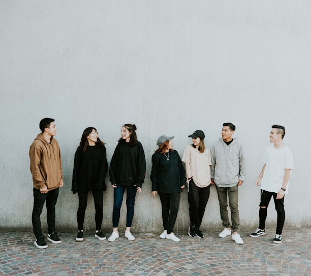 people standing near wall