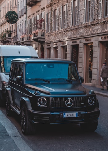 Mercedes-Benz SUV parked on sidewalk