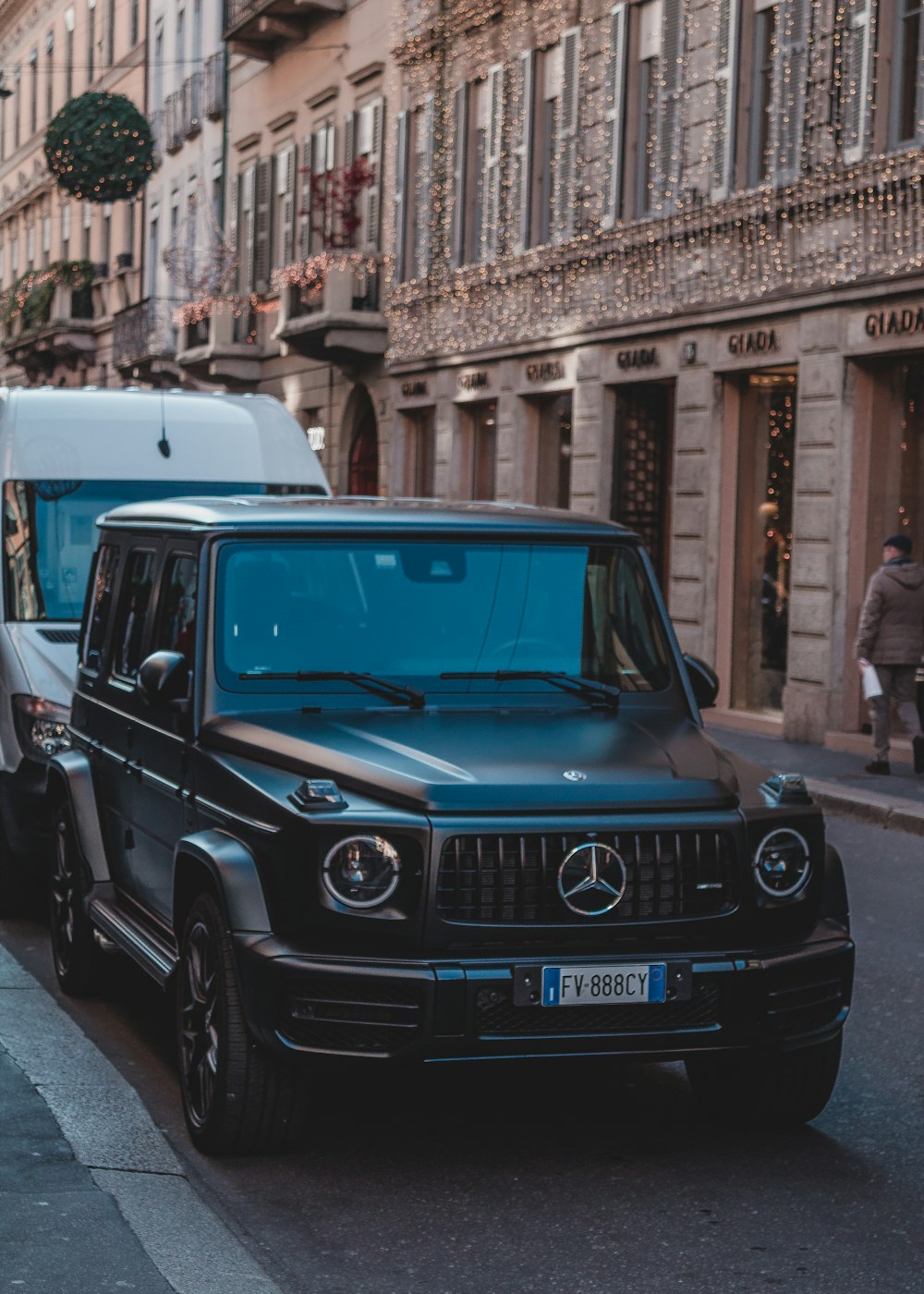 Mercedes-Benz SUV parked on sidewalk