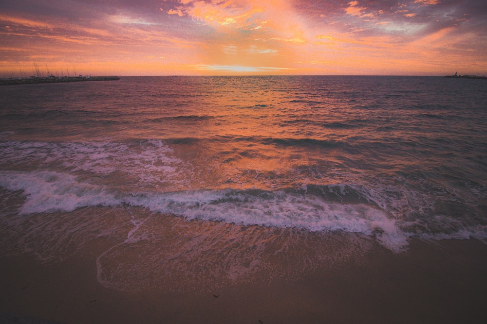 body of water during golden hour