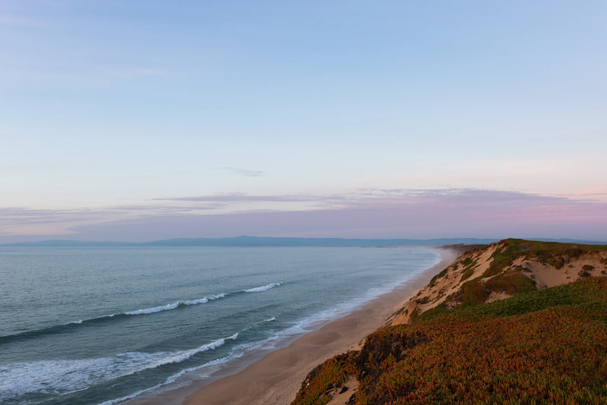 A dune bluff above the beach on Monterey Bay at dusk