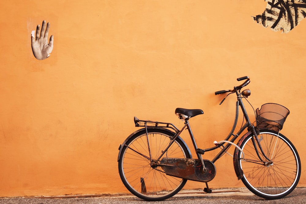 minimalist photography of a bicycle parked on sidewalk