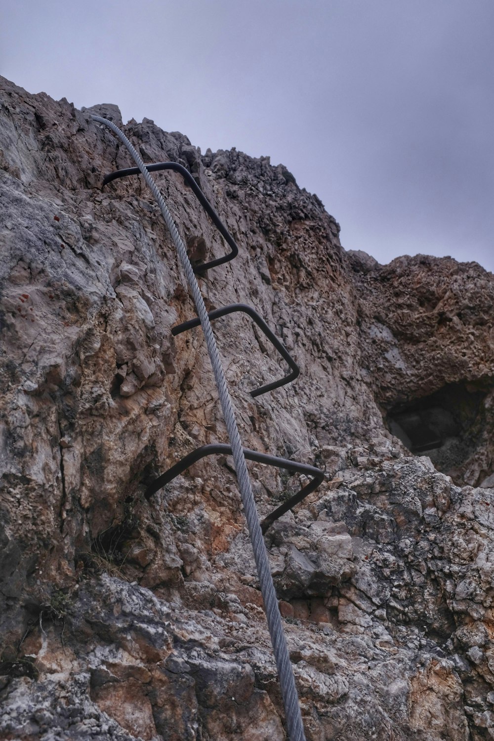 metal ladder on a rocky mountain