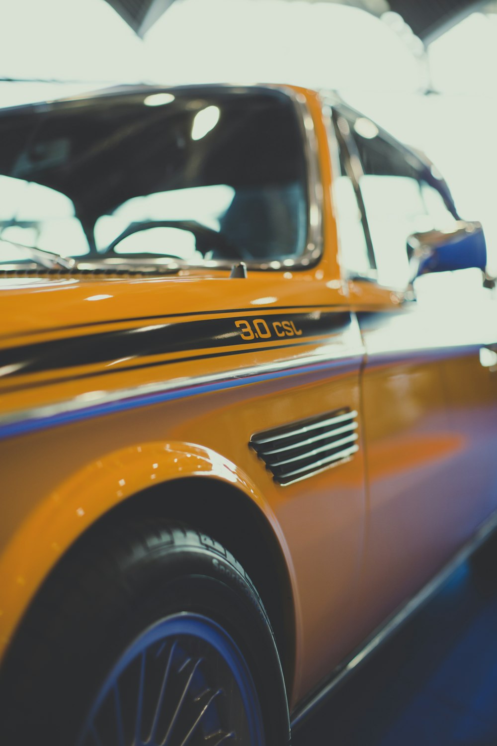 selective focus photography of yellow car