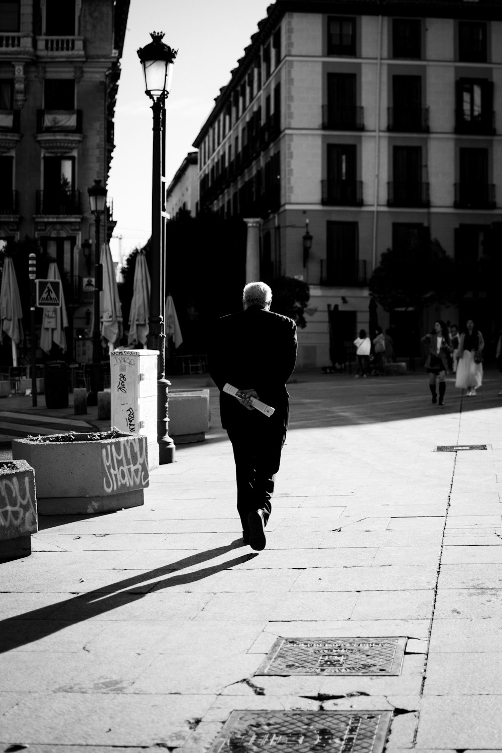 man walking near structures