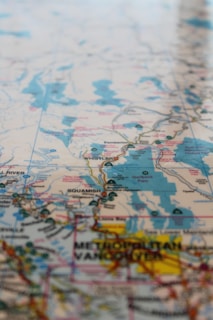 A detailed map showcasing a region with various geographical details such as mountain ranges, rivers, and city names. Notable locations include Whistler, Squamish, and Vancouver. The map uses a variety of colors to denote different terrains and landmarks.