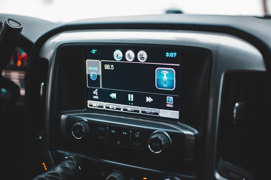 turned-on black vehicle 2-DIN stereo