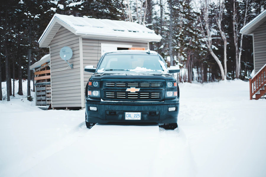 Service truck with roof light bar parked on a cleared residential driveway