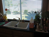 Before and after shots of a spotless kitchen cleaned by Aquabloom Cleaning team.