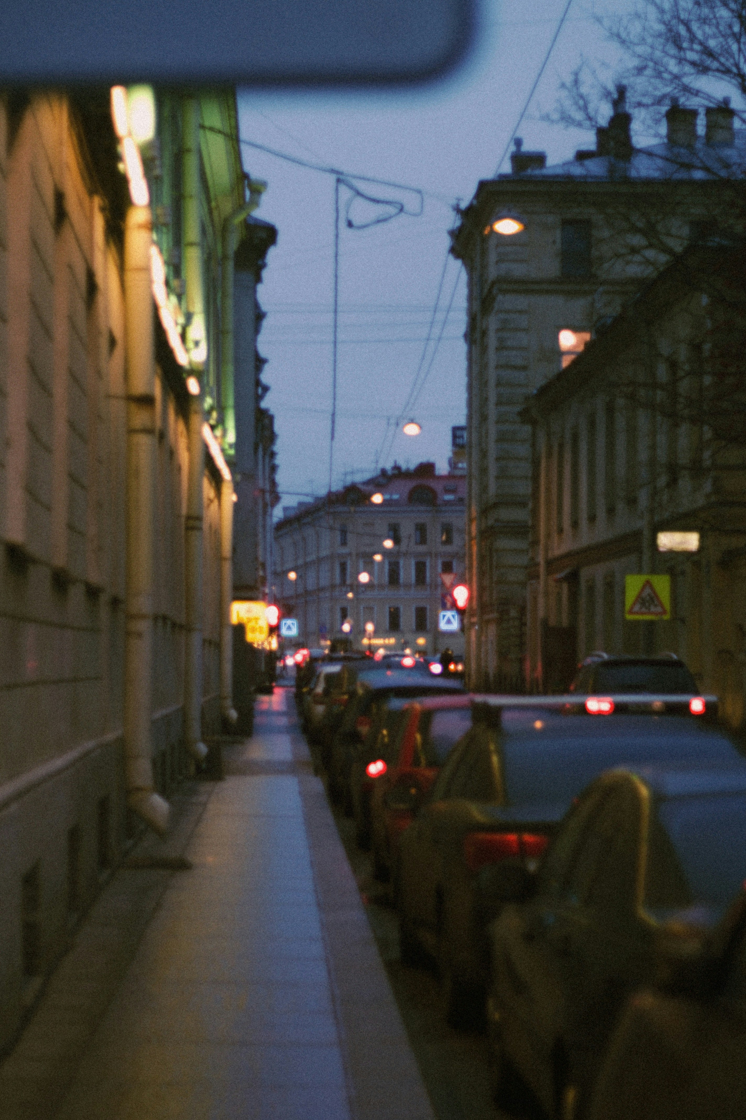 Row of parked vehicles in a commercial lot at dusk representing a business fleet