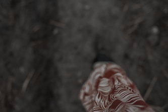 Close-up of feet walking cautiously on uneven ground, symbolizing balance issues
