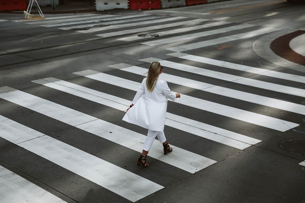 woman crossing on pedestrian