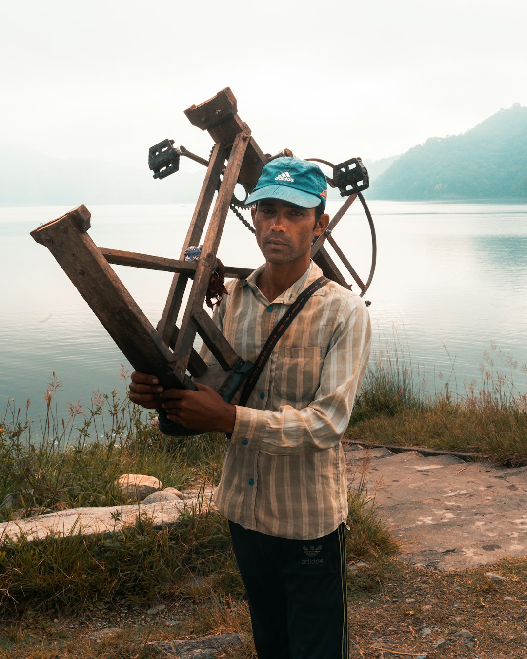 man holding wooden bike