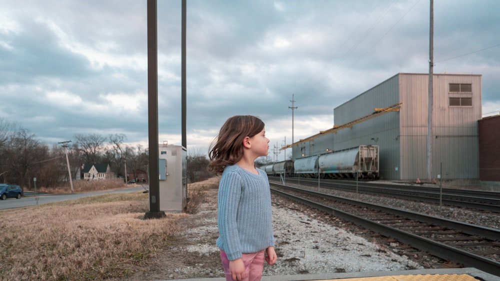 girl standing near building