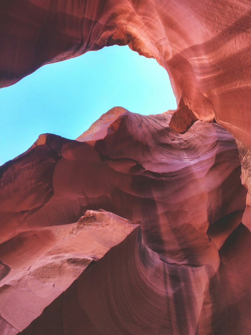 low-angle photography of Grand Canyon under blue sky