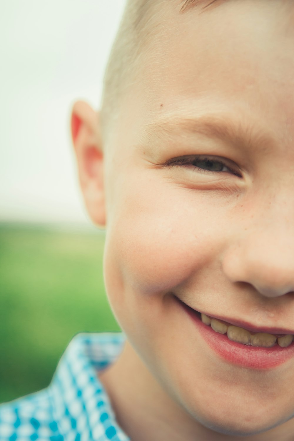 boy in blue and white collared shirt